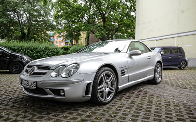 Mercedes-Benz R230 SL 65 AMG V12-Motor 612 PS mit Schmetterlingstüren AMG-Doppelspeichenrad Keyless-Go Hardtop Persenning Tempomat Sitzheizung (2005)