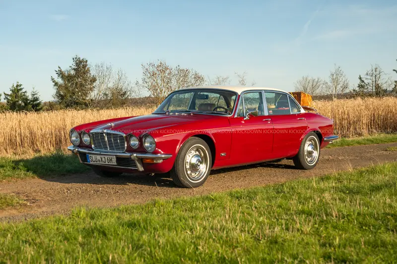 1977 Jaguar XJ6 with a Classic Analytics rating of 2, left-hand drive, fitted with high-quality whitewall tires, and equipped with a trunk rack