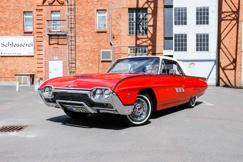 1963 Ford Thunderbird with H license plate, a classic American car in red with a fully retractable convertible top, completely restored